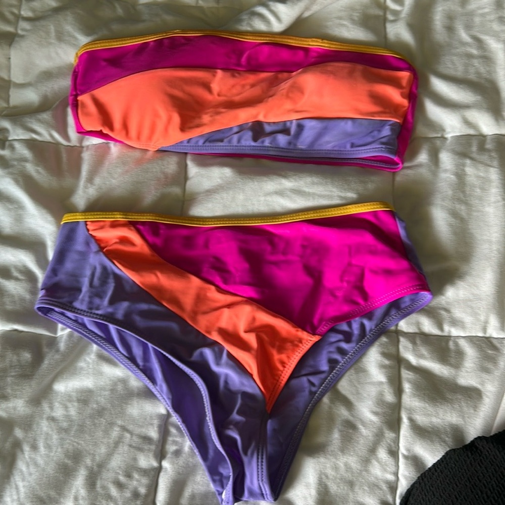 Bikini,not new but in good condition, orange,purple,pink.
